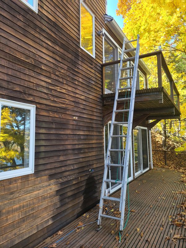 Staging set against a barn elevation for restoration work