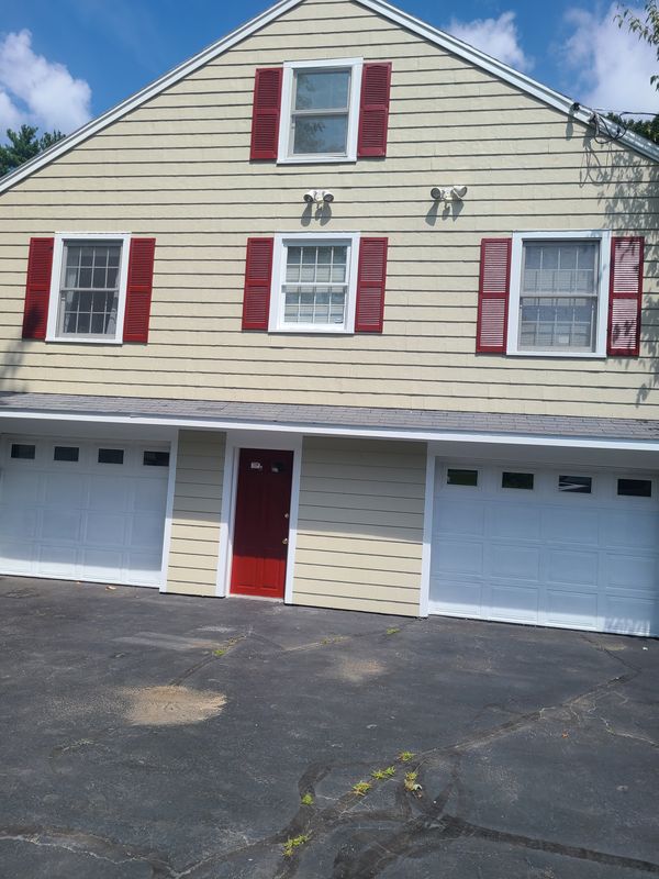 Garage elevation and red door after exterior work