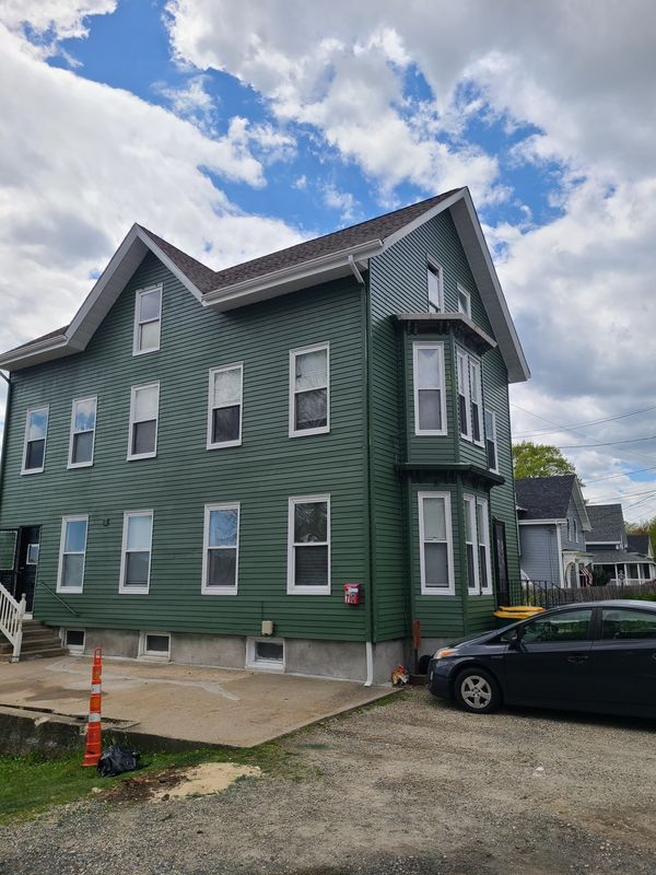 Green three-decker after a full exterior repaint