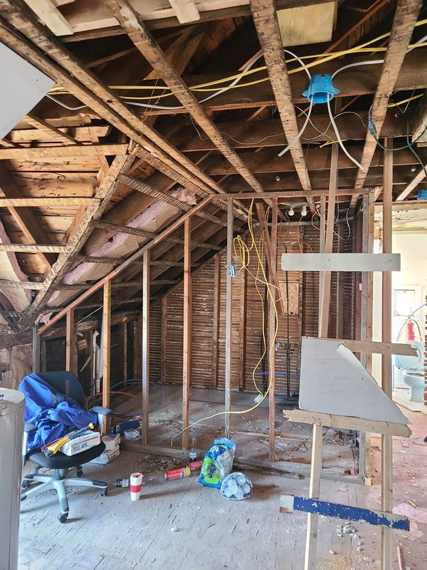 Interior gut renovation with framing and new wiring exposed