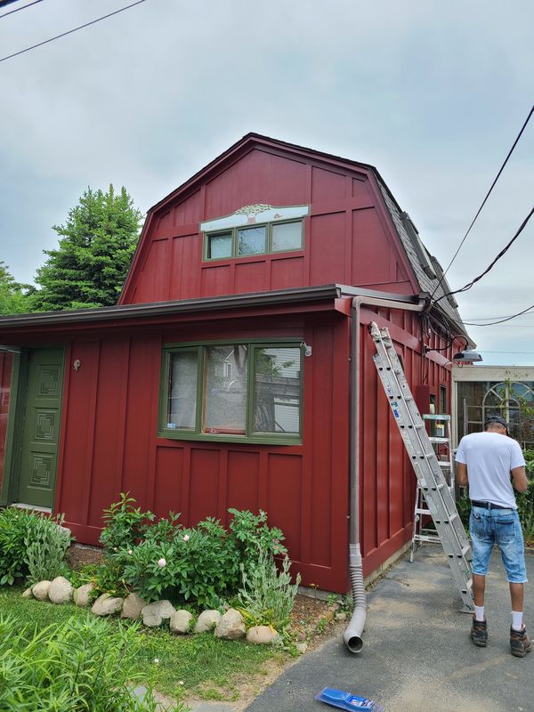 Red gambrel three-family being repainted
