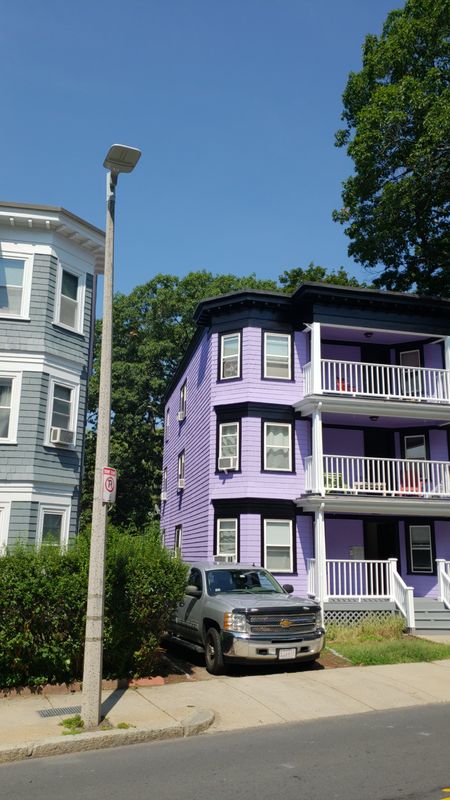 Shingle side elevation of a three-decker after full repaint