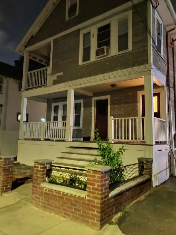 Two-family porch and new brick steps after finishing